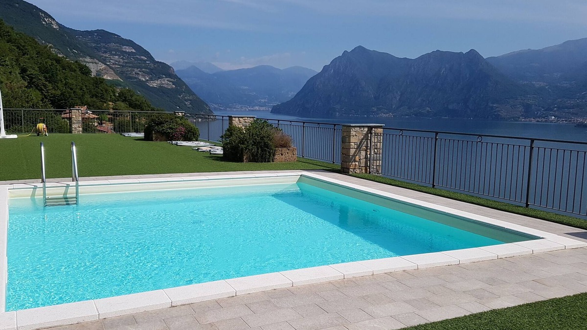 Tavernola Bergamasca Apartment | Vacation apartment with wonderful panoramic lake view, 2 terraces, pool, parking lot