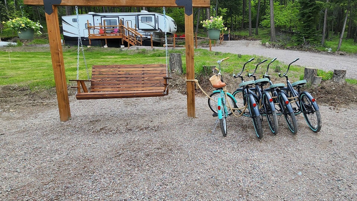 Lakeside House | Vacation Camper with private area behind with Seating, Firepit, and Hot tub