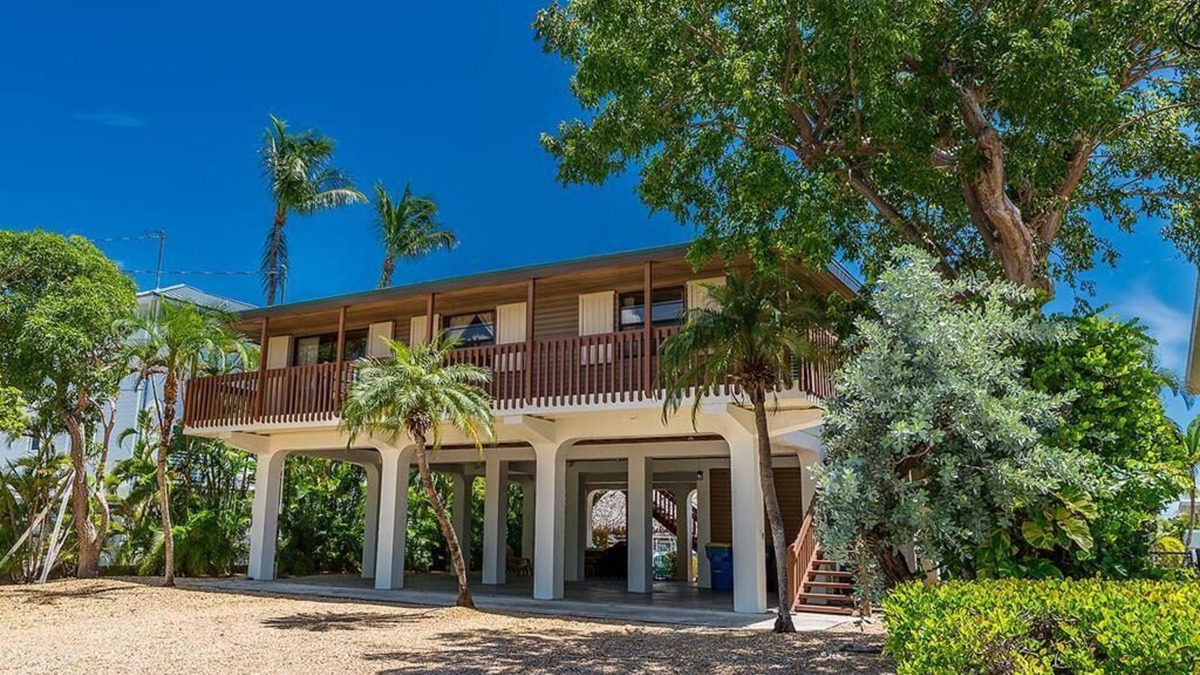 Venetian Shores House | Venetian Shores Retreat with Boat Lift, Tiki Hut & Hot Tub