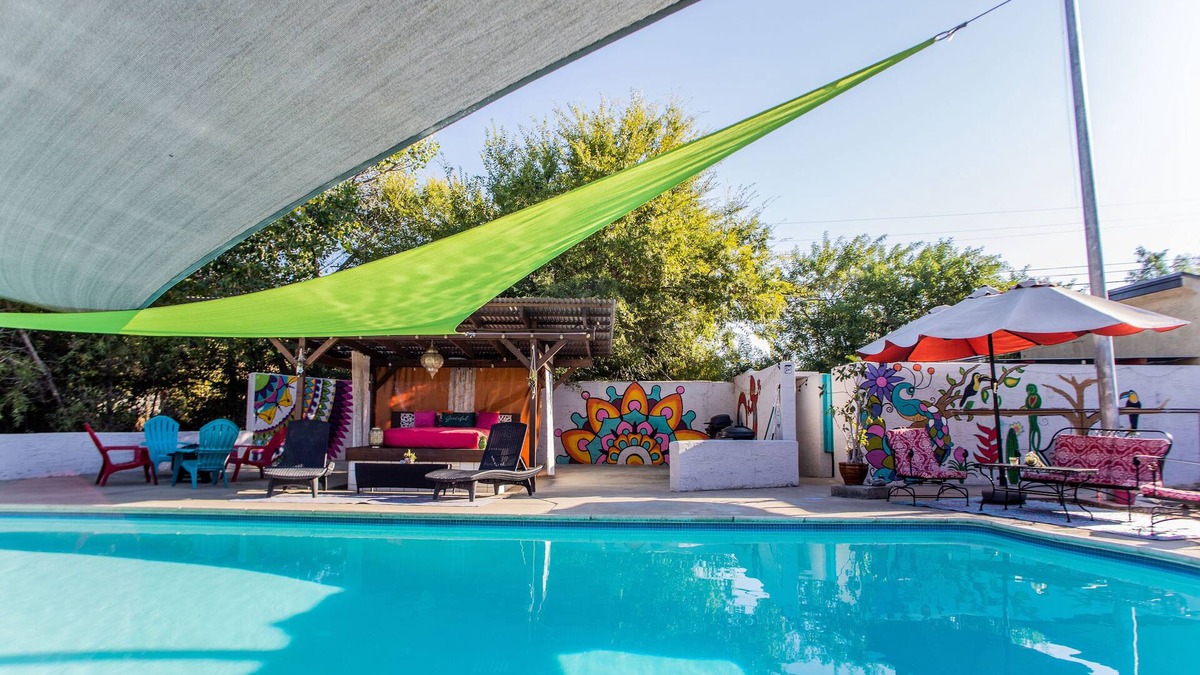 Lakeside Apartment | Vibrant Bohemian Loft Apartment with Shared Pool, Garden & Colorful Murals