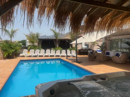 Puerto de Santiago Villa | VILLA BLOSSOM in the beautiful area of Puerto Santiago Tenerife with 5 bedrooms for up to 10 guests private swimming pool and many other activities to entertain the family Secure parking for 2 cars and disabled access throughout