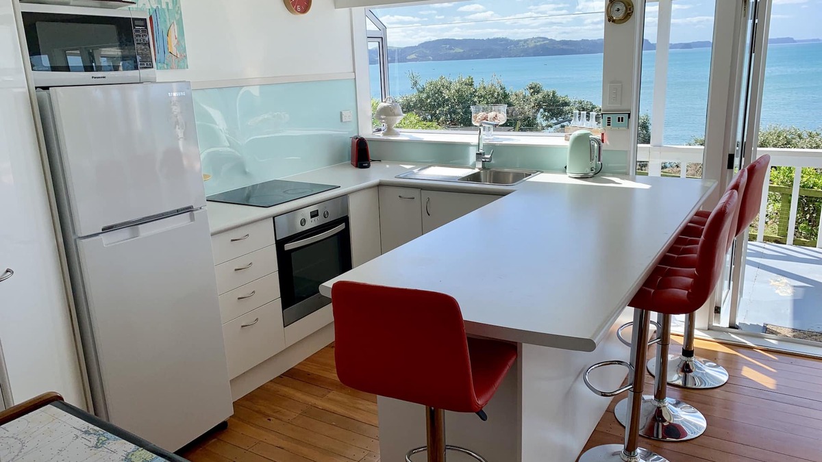 Red Beach House | Vintage Retro style Bach with stunning sea views