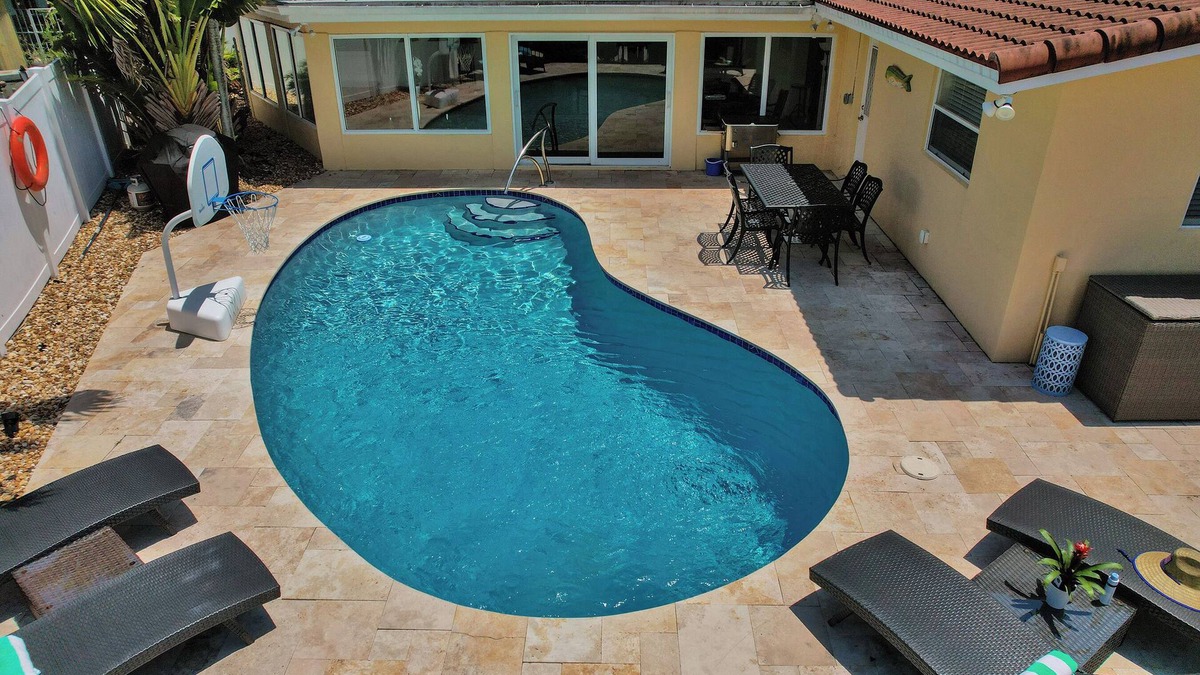 Bel Air House | Walk to the beach! Tiki Hut, Waterfront, Heated Pool, kayaks, bicycles, arcade!