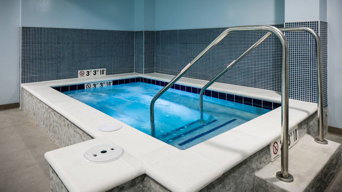 Historic East Village Condo | Warm and Welcoming Suite | Free Breakfast, Indoor Pool + Hot Tub