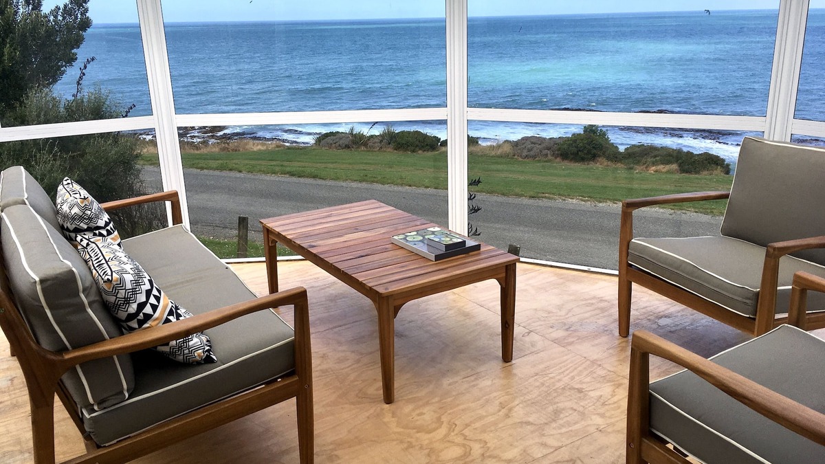 Kakanui House | Watch the weather roll in along the coast with sea views from every room.