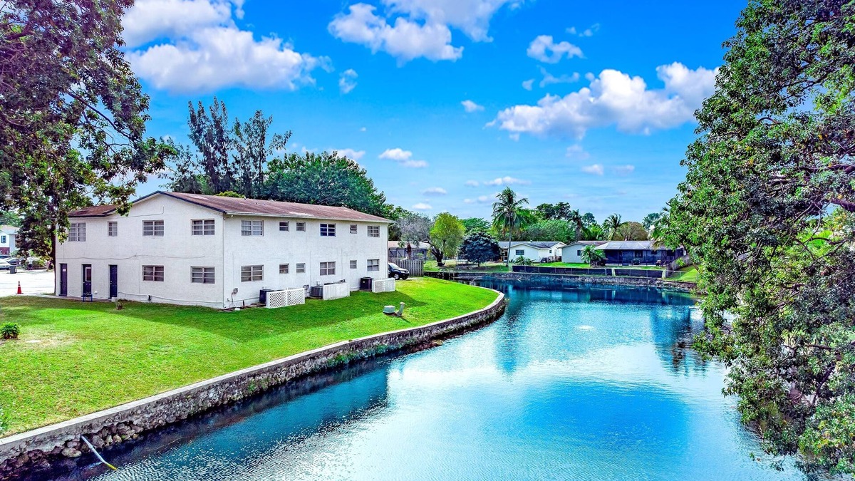 Survey Creek Apartment | Water View - King Bed - Palm Wave Says