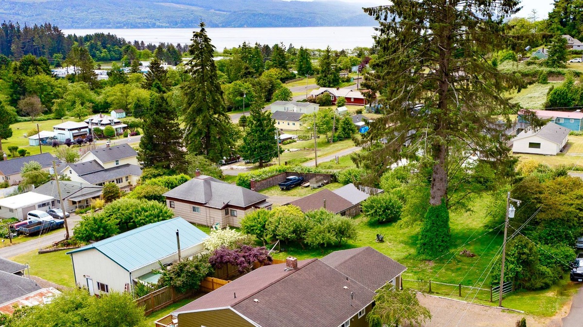 Bay City House | Water view retreat with scenic deck, grill, yard, fireplace, board games, & W/D