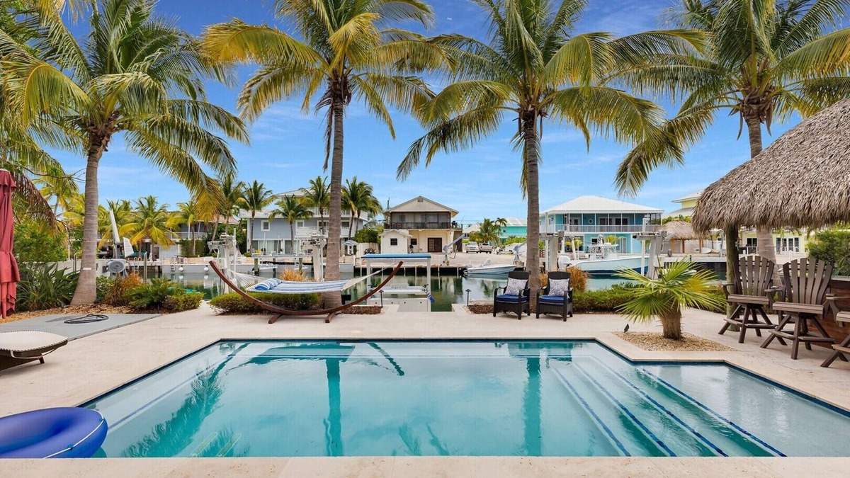 Venetian Shores House | Waterfront Getaway in Venetian Shores – Pool, Hot Tub, Tiki Hut & More