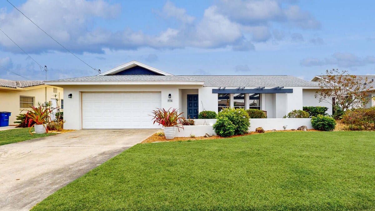 Lochmoor Waterway Estates House | Waterfront home with pool, bikes, grill, fireplace, internet, W/D, & central AC