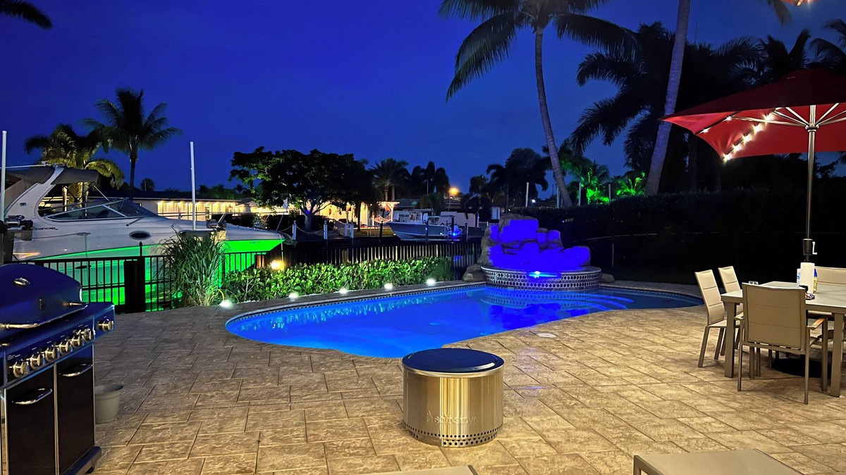 Garden Isles House | Waterfront home with private backyard. Heated pool with waterfall Jacuzzi