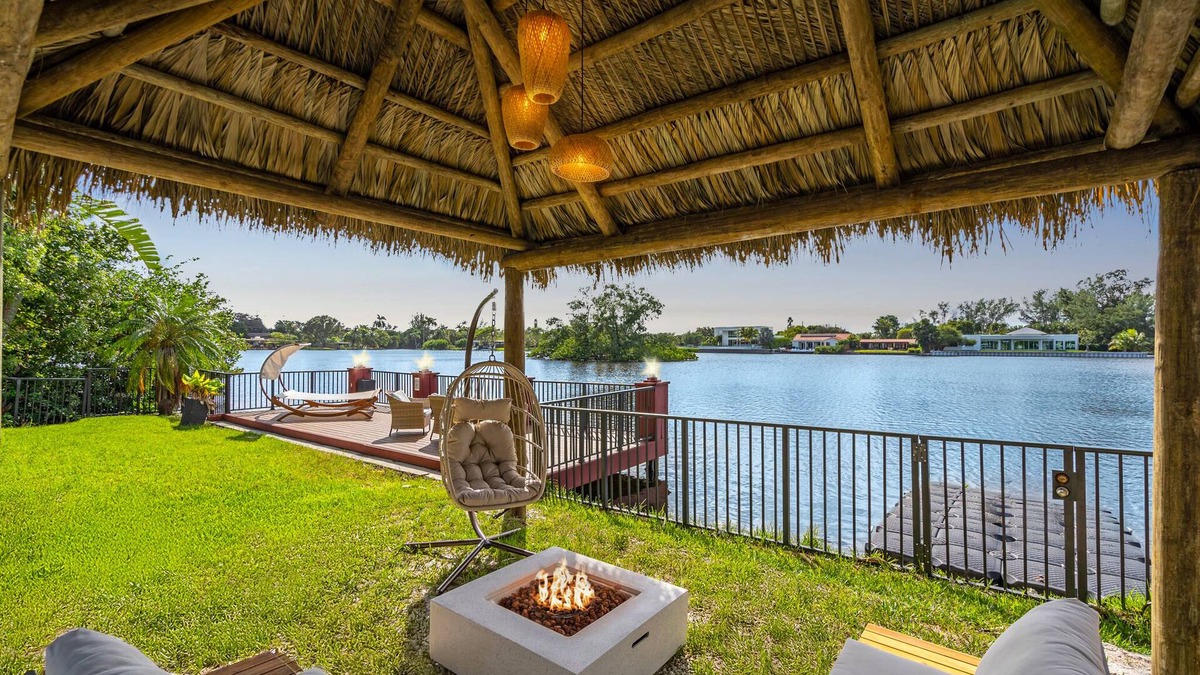 Ojus House | Waterfront Jungle House, Firepit, Kayaks & Sunset