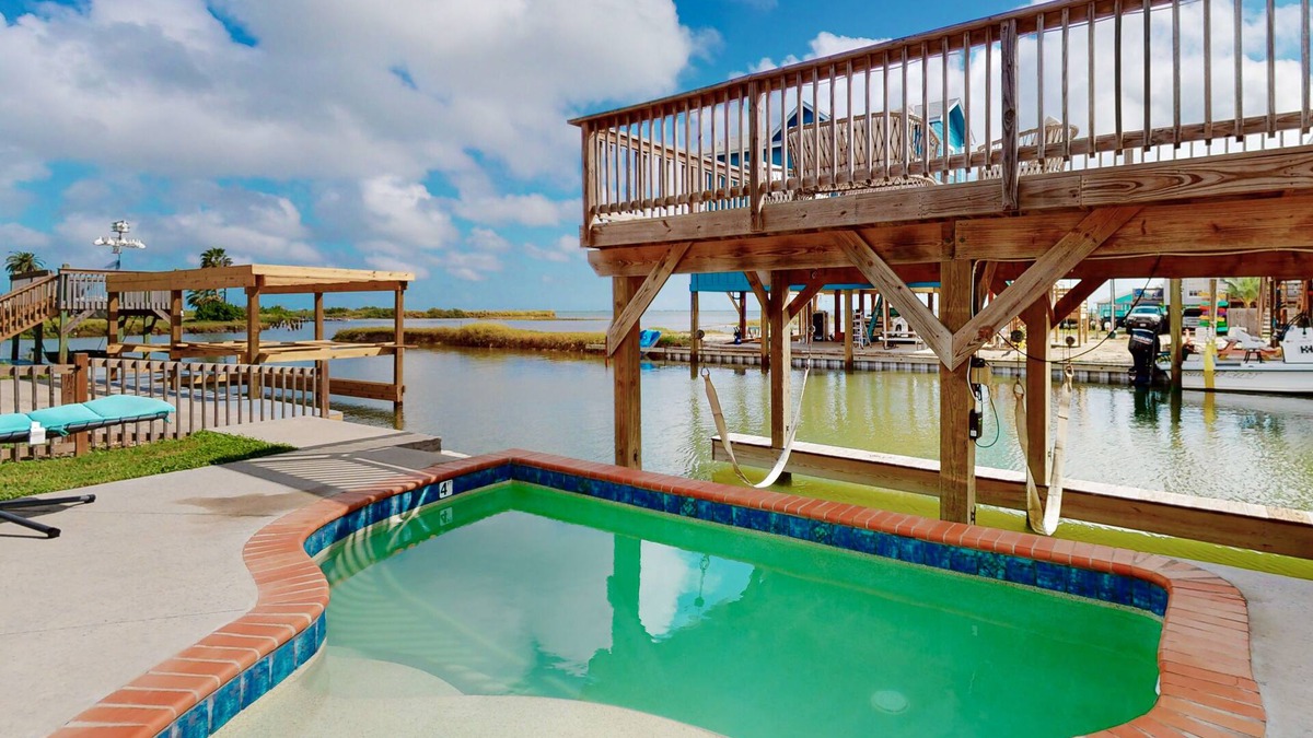 Flour Bluff House | Waterfront monthly rental with private pool, boat slip & 2 SUPs