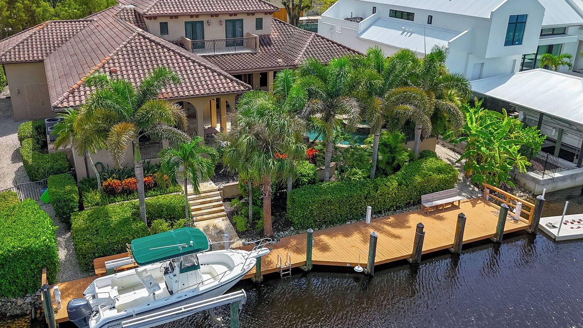Aqualane Shores House | Waterfront Paradise in Aqualane Shores | 4BR Estate with Pool & Dock