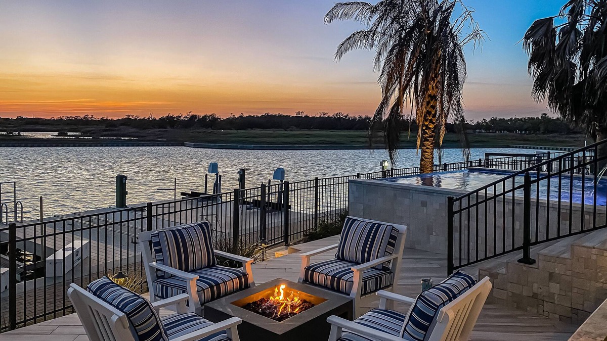 Rockport House | Waterfront paradise with private pool, dock, poolside TV & multi-TV game room