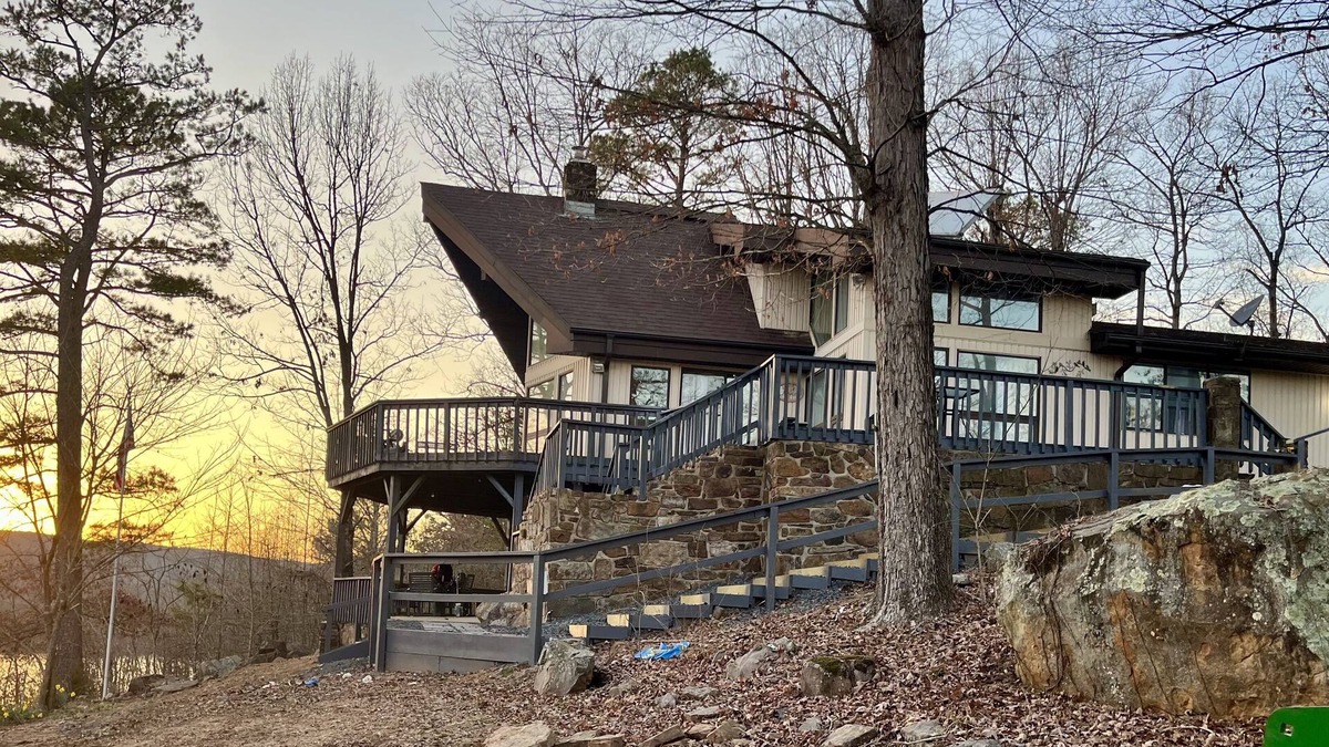 Center Ridge House | Watershed Getaway on lake, mountain behind house on property, and hiking trails