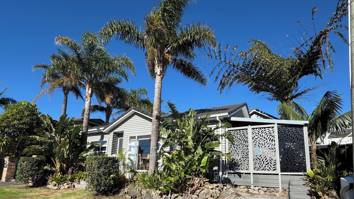 Browns Bay Cottage | Your coastal escape. Walk to the beach. Private spa, whole house access.