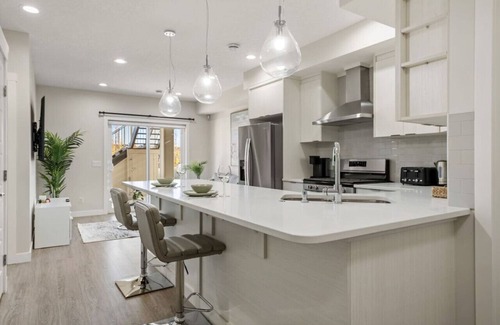 Sage Hill Apartment | 1BR Walk Out Suite » Backyard » Patio » 65” TV