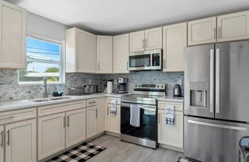 Riviera Beach House | 4-bedroom house in charming Riviera Beach with WiFi, AC. Relax and unwind
