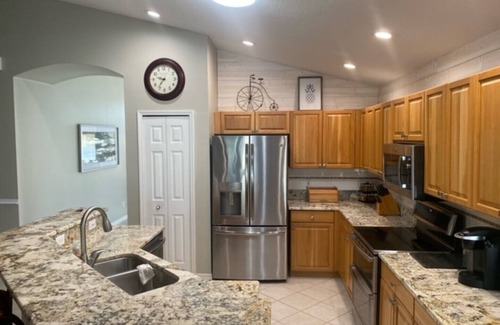 Imperial Lakewood's House | 4 Bedroom house with a heated pool on a public golf course