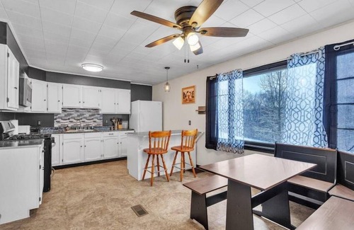 Sharpsburg House | 8700 Wood Rd, Chesterhill, OH - Property with a small cabin and a single family home