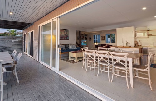Scotts Head House | Absolute waterfront beach house with massive deck - family and dog friendly