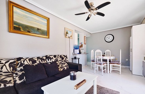 Punta Prima Apartment | Apartment with 2 bedrooms, Wi-Fi, air conditioning, sea view, pool, and garage