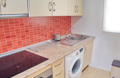 Orihuela Costa Apartment | Apartment with Large Roof Solarium, Pool, Garden, Barbecue, A/C & Wi-Fi