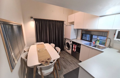 Pukehangi House | Arias Farmlet Tiny Home - quiet bungalow with breakfast, spa, animals to feed