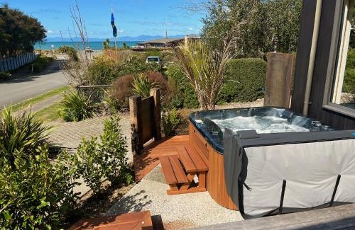 Marahau House | Bach 7 by The Sea - Spa Pool and Views