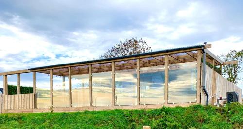 Cronberry House | Barlosh Barony Tpod Lodge Ayrshire, elec jacuzzi, BBQ, Firepit, Pizza Oven, indoor outdoor terrace with amazing views, spacious inside and out