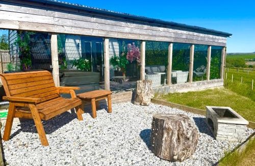 Cronberry House | Barlosh kiloch Tpod Lodge, Ayrshire, elec jacuzzi, bbq, Firepit, indooroutdoor terrace with outdoor sofa, egg chair,dinning country views,etc very spacious inside and out