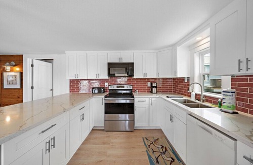 Surfside Beach House | Beach Getaway with Game Room & Tiki Bar