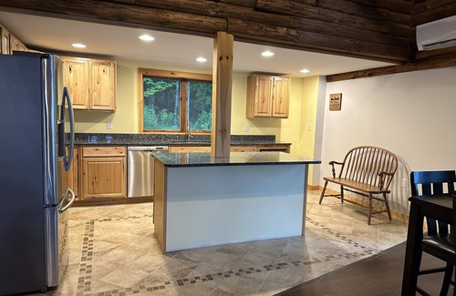 Ellsworth House | Beautiful private beach area within steps from the modern updated log home