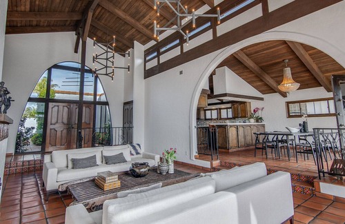 Gilbert Island House | Beautiful Spanish style waterfront home in Huntington Harbor- minutes from beach