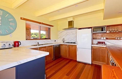 South Bruny House | Cloudy Bay Villa - Cloudy Bay Villa offers visitors a unique experience on secluded south Bruny Island. This spectacular two-story house on a gentle rise over Whalebone Point offers some of the best views in Tasmania.