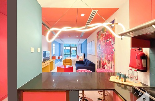 Dubai Sports City Apartment | Colorful Studio with Balcony & City Views