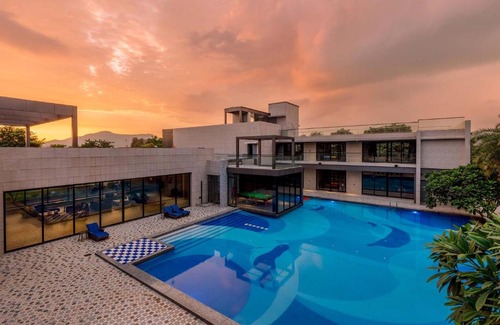 Khalapur Villa | Colossus by StayVista - Riverside luxury villa in Khalapur with a Spacious pool, Sauna, Private theater, Gazebo & Lawn