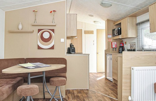 Gwespyr House | Comfortable 12ft-wide caravan with one double and one twin.