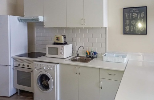 Benaojan Apartment | Comfortable and compact apartment in Ribera del Guadiaro apartment complex with community pool.