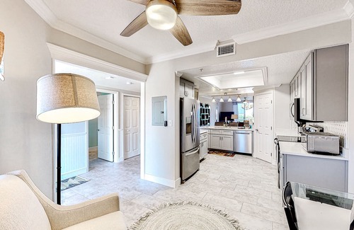 Port Canaveral Condo | Comfy condo in great location with pool, covered balcony, fast WiFi, W/D & AC