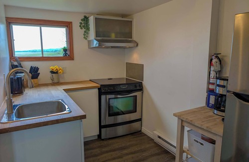 Ste Anne de Beaupre Apartment | Condo 2 - Bord de l'eau, SPA, Barbecue & Foyer