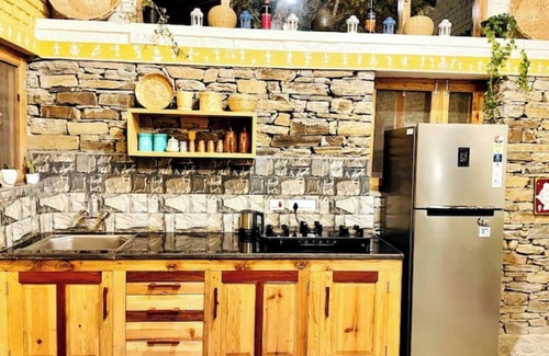 Almora House | Cozy bungalow nestled in the Himalayas, snow-capped peaks, Kumaoni culture.