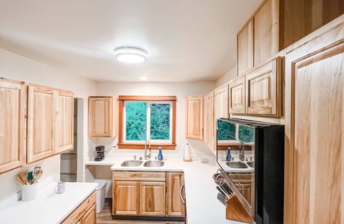 Kodiak House | Cozy up in this private bungalow in the trees close to trailheads & shopping