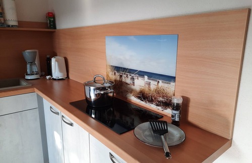 Ostseebad Kuhlungsborn Apartment | Cozy vacation apartment with natural stone terrace surrounded by greenery