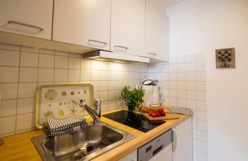 Wittduen Apartment | Cute one-room-apartment with sea view, balcony, close to the village with its sh