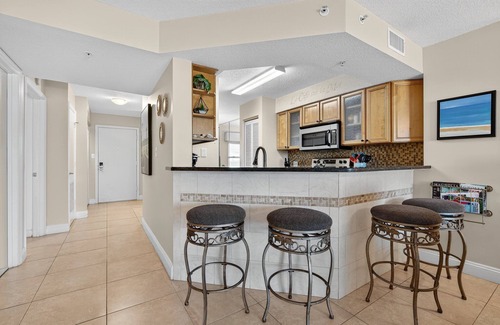 Seawinds Condo Condo | Direct oceanfront condo with a private balcony, heated beachfront pool, and garage