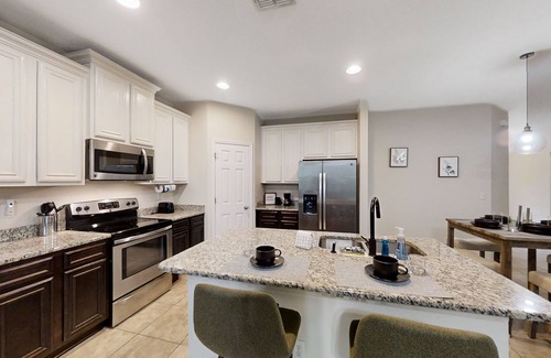Westside House | Dog-friendly home with a screened porch, washer/dyer, games & modern charm