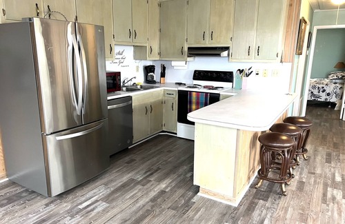Indian Bay House | Dolphin Watch A - Remodeled - Waterfront Fishing Paradise! Bring your Dog!