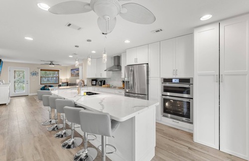 Caloosahatchee House | "DOUBLE CAPE ESCAPE".PRIVATE WATERFRONT OASIS W/HEATED POOL, DOCK & PATIO BAR