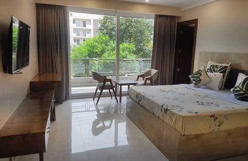DLF Phase 3 Hotel | Double Delux Room @ Sterling Room with Balcony Near DLF Cyber City